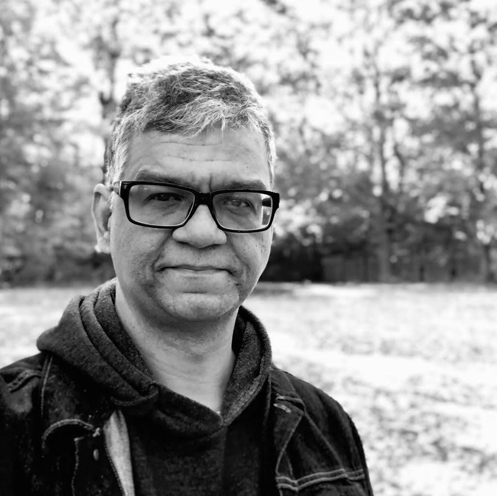 A black and white photographic portrait of Fabio Silva Magalhaes