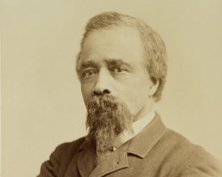 Old sepia tone portrait of a man in a suit jacket