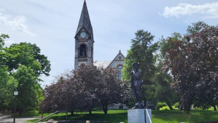 Building with a spire in with trees